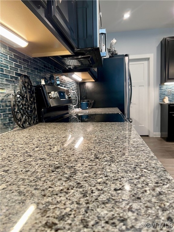 15518 Centerline Ct, Chesterfield, VA 23832 - kitchen with backsplash, range, light stone countertops, and wood finished floors