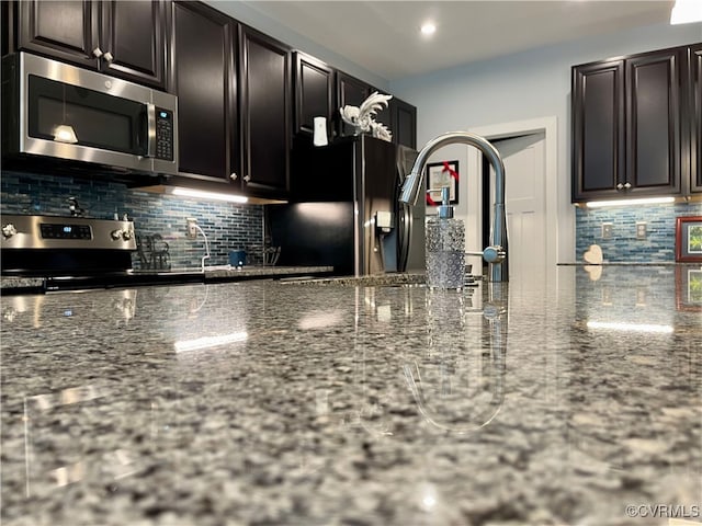 15518 Centerline Ct, Chesterfield, VA 23832 - kitchen with appliances with stainless steel finishes, backsplash, dark stone counters, and recessed lighting