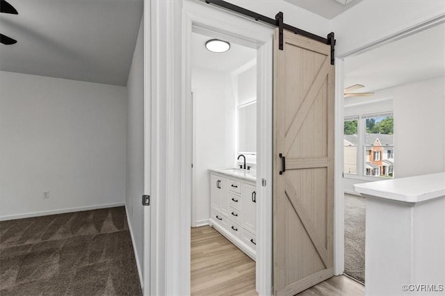15241 Broadwater Cir, Chesterfield, VA 23831 - hallway featuring a barn door and light carpet
