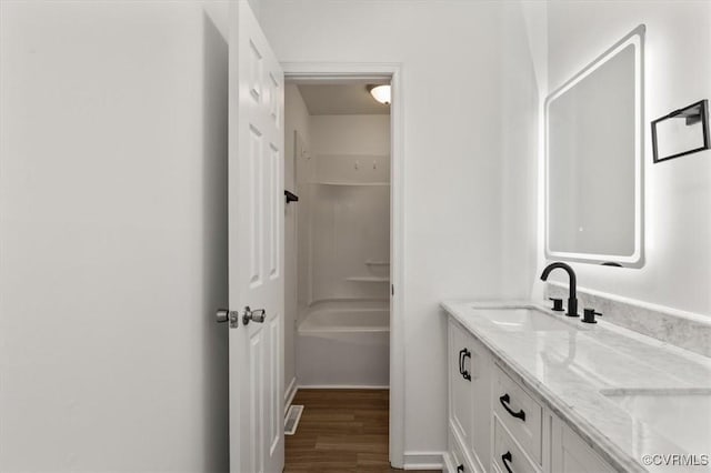 15241 Broadwater Cir, Chesterfield, VA 23831 - bathroom featuring double vanity, wood finished floors, and bathtub / shower combination