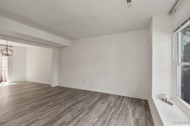 15241 Broadwater Cir, Chesterfield, VA 23831 - spare room with wood finished floors and a chandelier