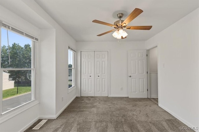 15241 Broadwater Cir, Chesterfield, VA 23831 - unfurnished bedroom featuring multiple windows, carpet, a closet, and ceiling fan