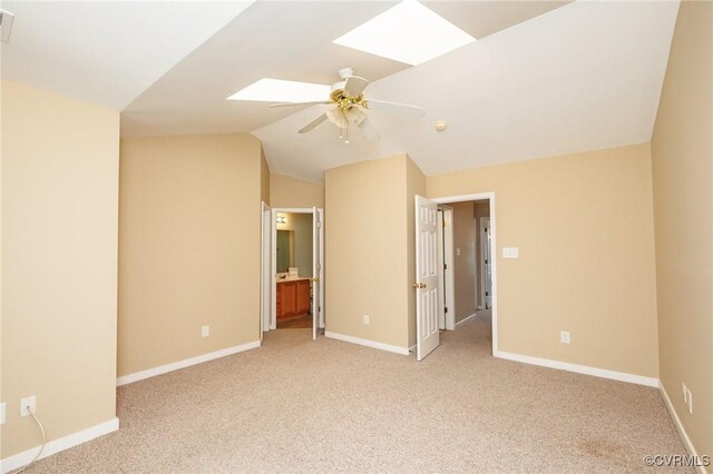 405 Hollybrook Ridge Ln, Richmond, VA 23223 - unfurnished bedroom with a skylight, light colored carpet, lofted ceiling, ceiling fan, and ensuite bathroom