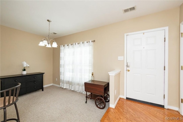 405 Hollybrook Ridge Ln, Richmond, VA 23223 - entrance foyer with a chandelier and light wood finished floors