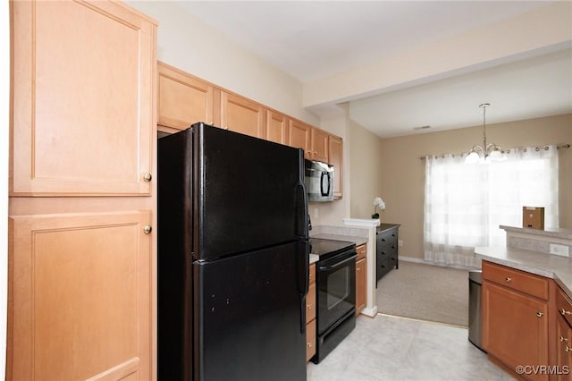 405 Hollybrook Ridge Ln, Richmond, VA 23223 - kitchen with black appliances, light brown cabinets, light countertops, a chandelier, and decorative light fixtures