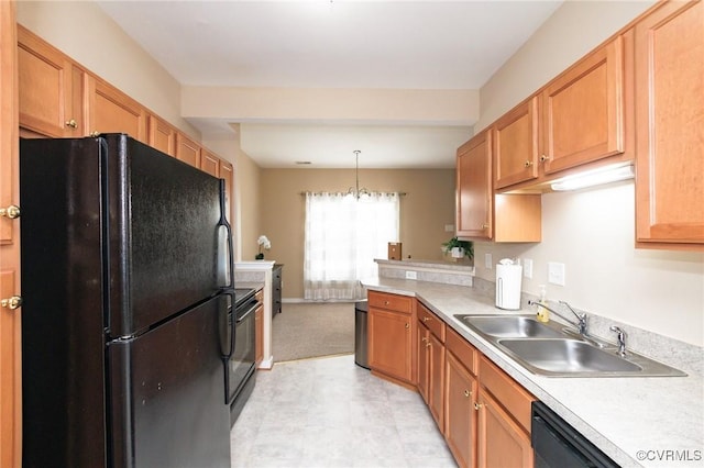 405 Hollybrook Ridge Ln, Richmond, VA 23223 - kitchen with black appliances, light countertops, hanging light fixtures, and a peninsula