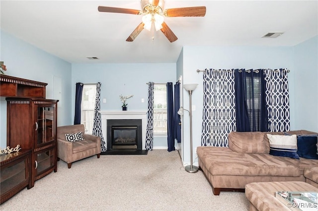 405 Hollybrook Ridge Ln, Richmond, VA 23223 - living room featuring light carpet, a fireplace with flush hearth, and a ceiling fan