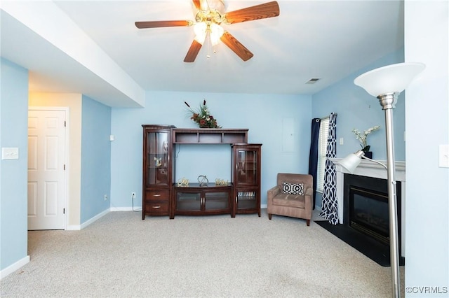 405 Hollybrook Ridge Ln, Richmond, VA 23223 - living area featuring carpet floors, ceiling fan, and a fireplace with flush hearth