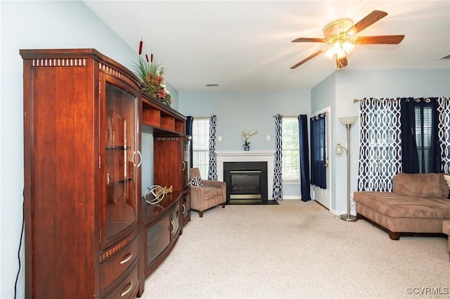 405 Hollybrook Ridge Ln, Richmond, VA 23223 - living area featuring a ceiling fan, light colored carpet, and a fireplace with flush hearth