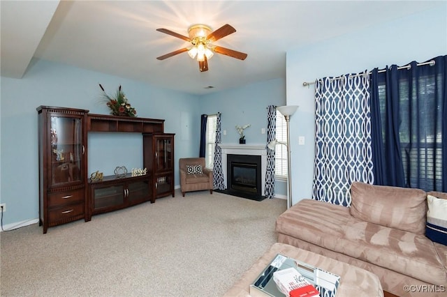 405 Hollybrook Ridge Ln, Richmond, VA 23223 - living area featuring carpet floors, ceiling fan, and a fireplace with flush hearth