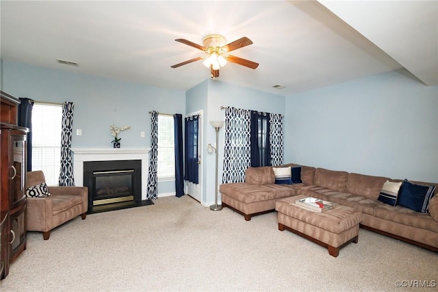 405 Hollybrook Ridge Ln, Richmond, VA 23223 - carpeted living area with ceiling fan and a fireplace with flush hearth