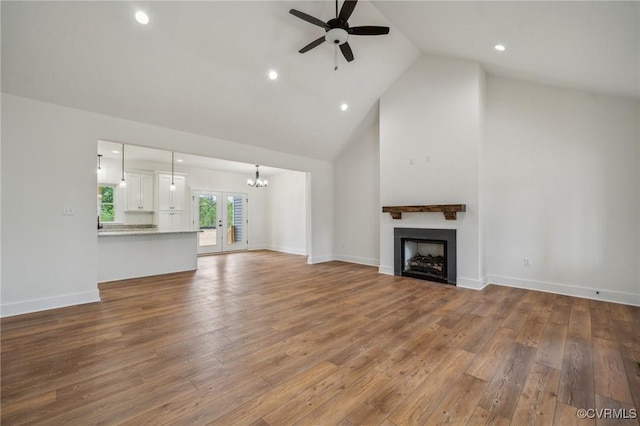 4858 Powhatan Lakes Rd, Powhatan, VA 23139 - unfurnished living room with a ceiling fan, a fireplace, high vaulted ceiling, hardwood / wood-style floors, and recessed lighting
