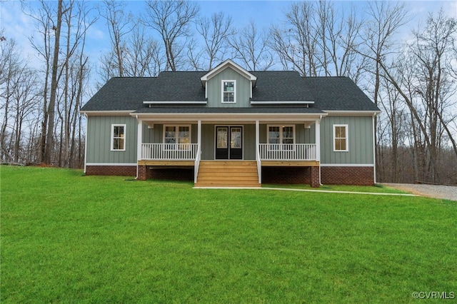 4858 Powhatan Lakes Rd, Powhatan, VA 23139 - view of front of house featuring board and batten siding, a front lawn, covered porch, and roof with shingles