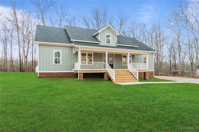 4858 Powhatan Lakes Rd, Powhatan, VA 23139 - view of front facade with a shingled roof, covered porch, a front lawn, board and batten siding, and stairway