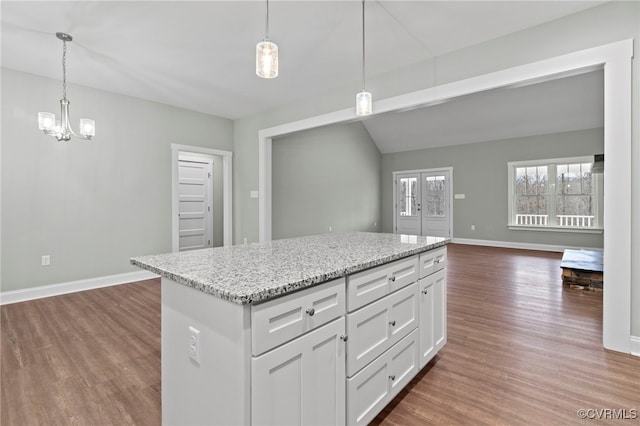 4858 Powhatan Lakes Rd, Powhatan, VA 23139 - kitchen with a chandelier, dark wood finished floors, white cabinets, a kitchen island, and vaulted ceiling