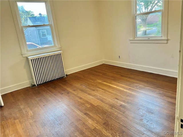 3305 Jeter Ave, Richmond, VA 23222 - unfurnished room with radiator, hardwood / wood-style floors, and plenty of natural light