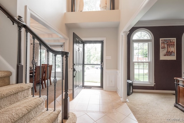 6013 Glen Abbey Dr, Glen Allen, VA 23059 - entryway featuring stairs, light tile patterned floors, wainscoting, crown molding, and ornate columns
