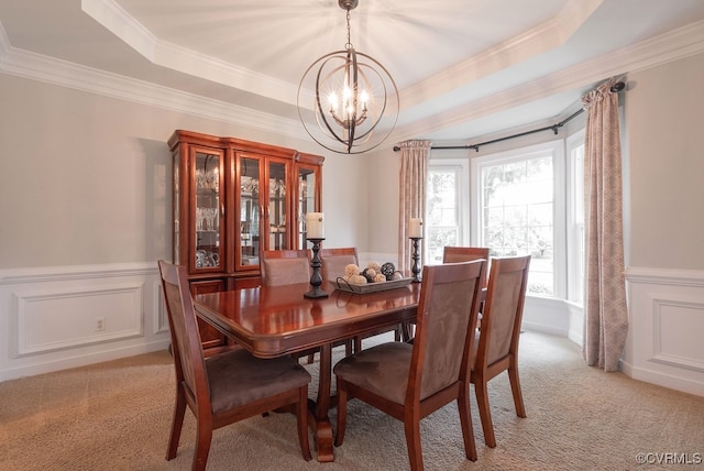 6013 Glen Abbey Dr, Glen Allen, VA 23059 - dining space featuring a chandelier, light carpet, ornamental molding, a raised ceiling, and wainscoting