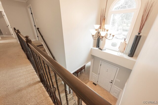 6013 Glen Abbey Dr, Glen Allen, VA 23059 - entrance foyer with light carpet and a chandelier