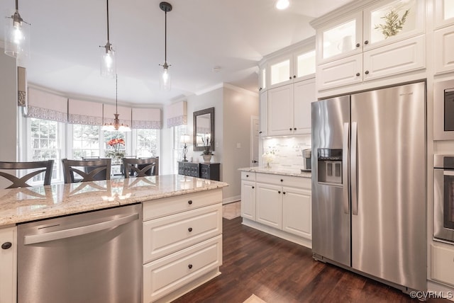 6013 Glen Abbey Dr, Glen Allen, VA 23059 - kitchen featuring appliances with stainless steel finishes, dark wood-style floors, crown molding, light stone counters, and recessed lighting