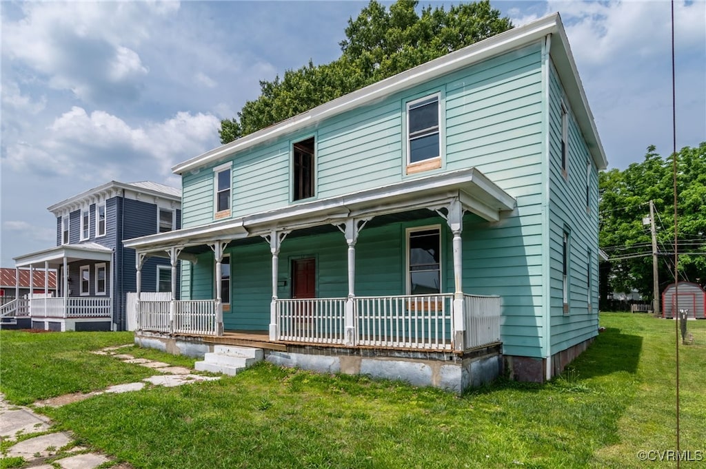 209 E Virginia Ave, Crewe, VA 23930 - view of front of home featuring a porch and a front yard