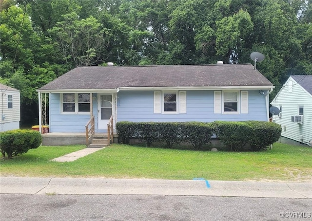 422 Walnut St, Petersburg, VA 23803 - view of front facade with a front yard and cooling unit