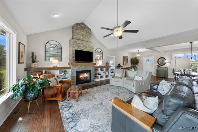 11561 Smokehouse Dr, Amelia Courthouse, VA 23002 - living area featuring a ceiling fan, dark wood-style floors, a stone fireplace, and high vaulted ceiling