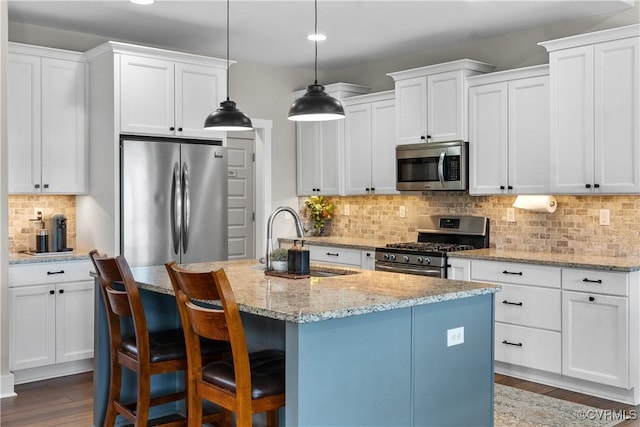 11561 Smokehouse Dr, Amelia Courthouse, VA 23002 - kitchen with appliances with stainless steel finishes, recessed lighting, tasteful backsplash, wood finished floors, and white cabinets