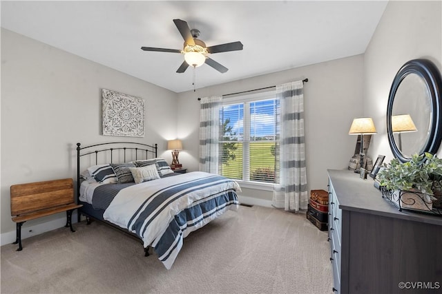 11561 Smokehouse Dr, Amelia Courthouse, VA 23002 - bedroom with light colored carpet and ceiling fan