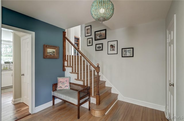 4824 Coleman Rd, Richmond, VA 23230 - stairs featuring wood finished floors and a chandelier