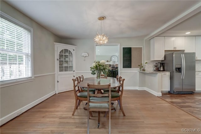 4824 Coleman Rd, Richmond, VA 23230 - dining area with light wood-style floors and a chandelier