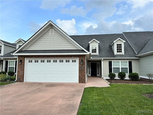 3316 Kennington Park Rd, King William, VA 23009 - view of front of home with driveway, an attached garage, a front yard, roof with shingles, and brick siding