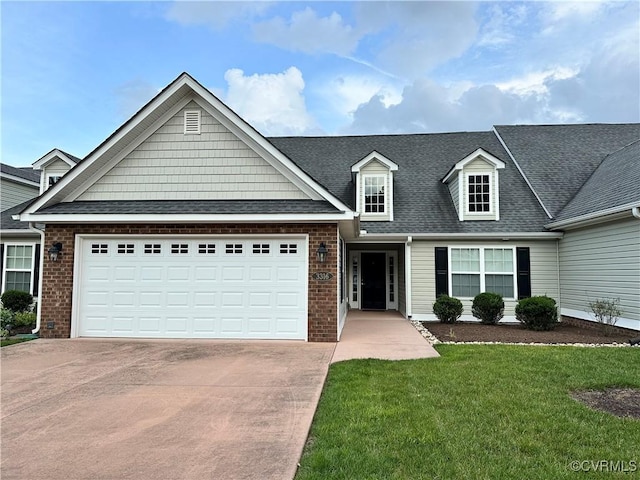 3316 Kennington Park Rd, King William, VA 23009 - view of front of house with concrete driveway, a garage, a front lawn, roof with shingles, and brick siding