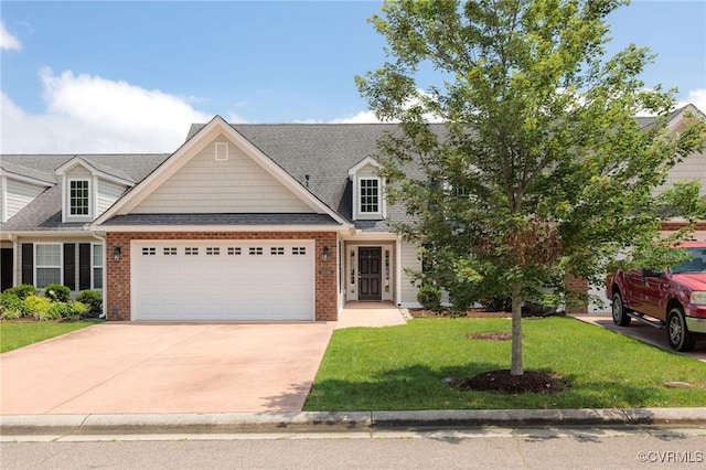 3316 Kennington Park Rd, King William, VA 23009 - view of front of house featuring an attached garage, driveway, a front lawn, brick siding, and roof with shingles