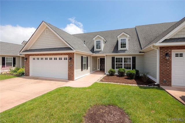 3316 Kennington Park Rd, King William, VA 23009 - view of front facade with a garage, driveway, and brick siding