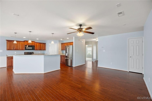 3316 Kennington Park Rd, King William, VA 23009 - kitchen with black microwave, stainless steel refrigerator with ice dispenser, brown cabinets, a ceiling fan, and dark wood-style floors