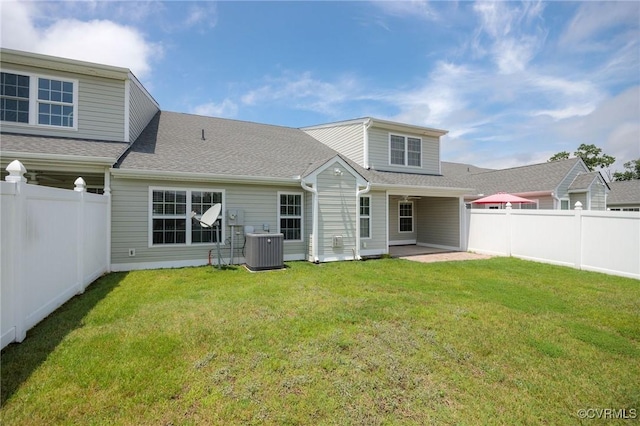 3316 Kennington Park Rd, King William, VA 23009 - back of property featuring a fenced backyard, a patio, and a shingled roof