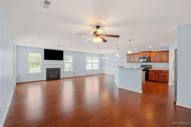 3316 Kennington Park Rd, King William, VA 23009 - kitchen featuring black microwave, range with electric cooktop, a ceiling fan, and plenty of natural light