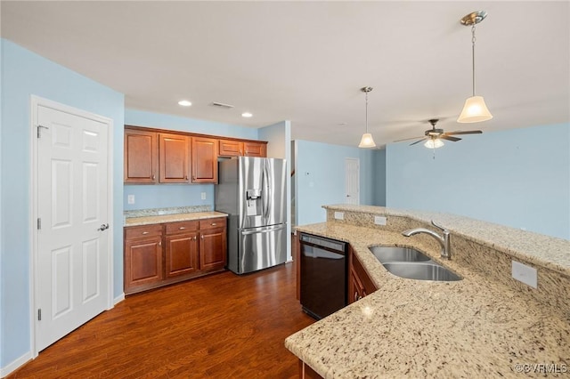 3316 Kennington Park Rd, King William, VA 23009 - kitchen with stainless steel refrigerator with ice dispenser, dishwasher, dark wood-style flooring, brown cabinets, and recessed lighting