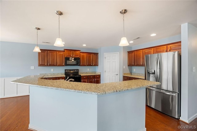 3316 Kennington Park Rd, King William, VA 23009 - kitchen featuring black appliances, dark wood-style flooring, light stone countertops, brown cabinets, and hanging light fixtures