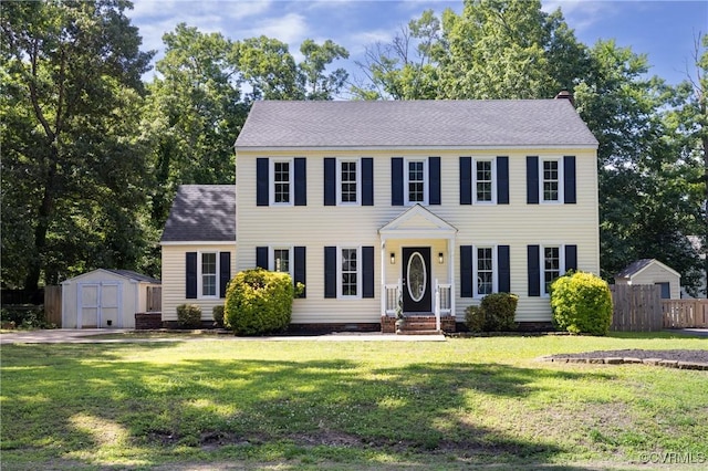13119 Glenmeadow Ct, Midlothian, VA 23114 - colonial home featuring a storage shed, a shingled roof, and a chimney
