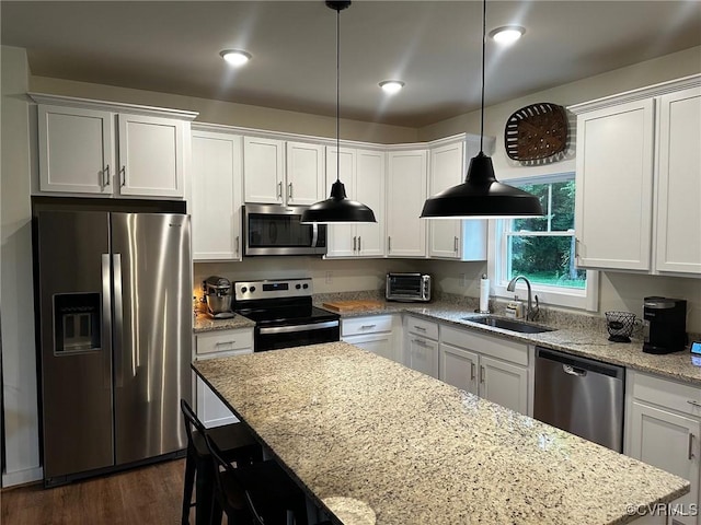 2942 Owens Creek Rd, Louisa, VA 23117 - kitchen with stainless steel appliances, white cabinets, light stone counters, and dark wood-style floors