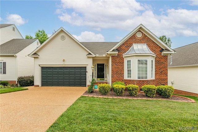 600 Krim Point Loop, Midlothian, VA 23114 - traditional home with brick siding, concrete driveway, an attached garage, and a front lawn
