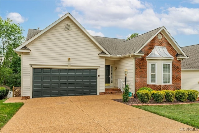 600 Krim Point Loop, Midlothian, VA 23114 - traditional-style home featuring concrete driveway, an attached garage, brick siding, and roof with shingles