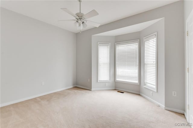 600 Krim Point Loop, Midlothian, VA 23114 - empty room featuring light colored carpet, ceiling fan, and plenty of natural light