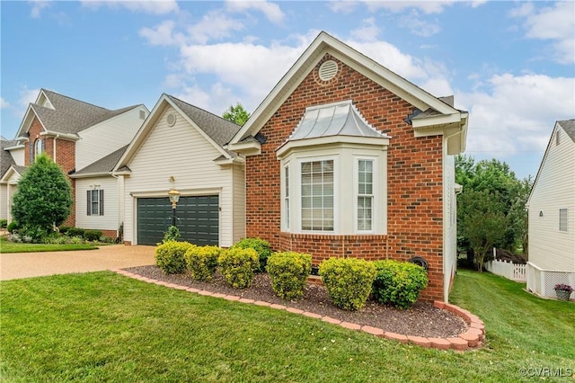 600 Krim Point Loop, Midlothian, VA 23114 - traditional-style home featuring brick siding, driveway, a garage, and a front yard