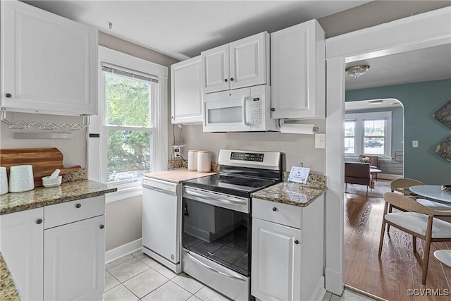 1708 Westwood Ave, Richmond, VA 23227 - kitchen featuring white appliances, healthy amount of natural light, and white cabinets