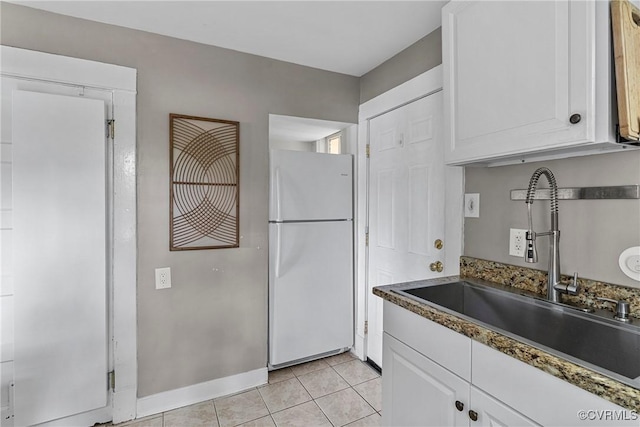 1708 Westwood Ave, Richmond, VA 23227 - kitchen with freestanding refrigerator, white cabinetry, and light tile patterned floors