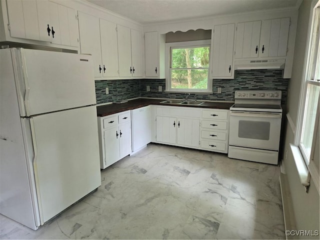 4562 Woodview Dr, Sandston, VA 23150 - kitchen with white appliances, dark countertops, under cabinet range hood, decorative backsplash, and light marble finish flooring