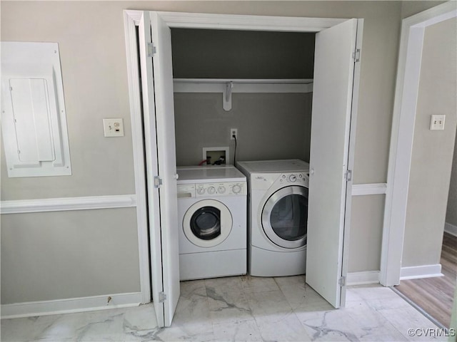 4562 Woodview Dr, Sandston, VA 23150 - laundry area featuring washer and clothes dryer, light marble finish floors, and electric panel